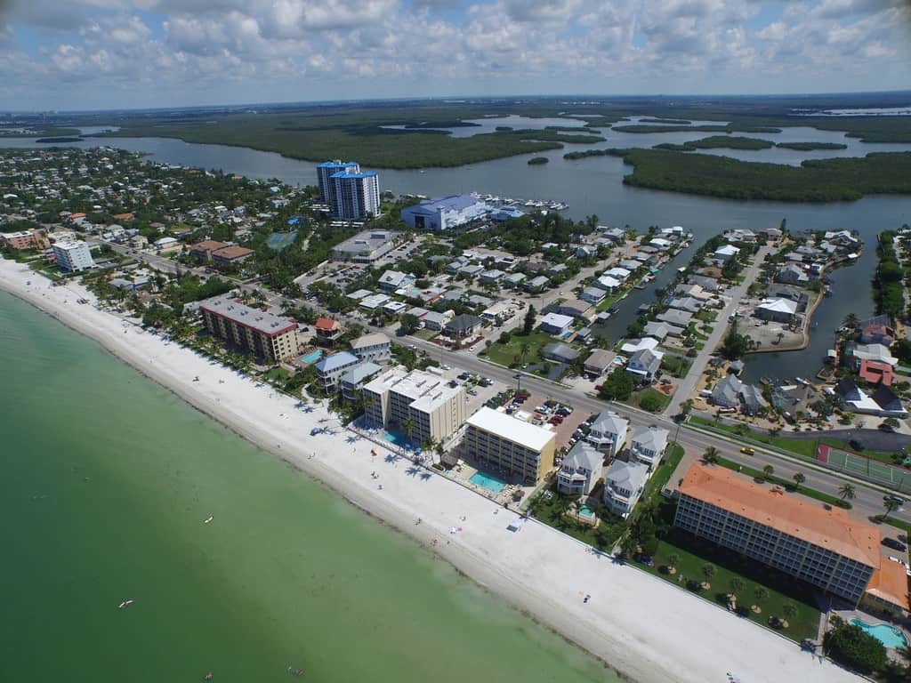 a large body of water with a city in the background a large body of water with a city in the background