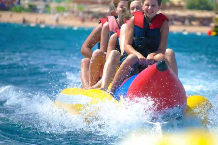 a girl riding a wave on a surfboard in the water