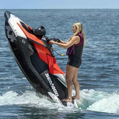a person standing next to a body of water