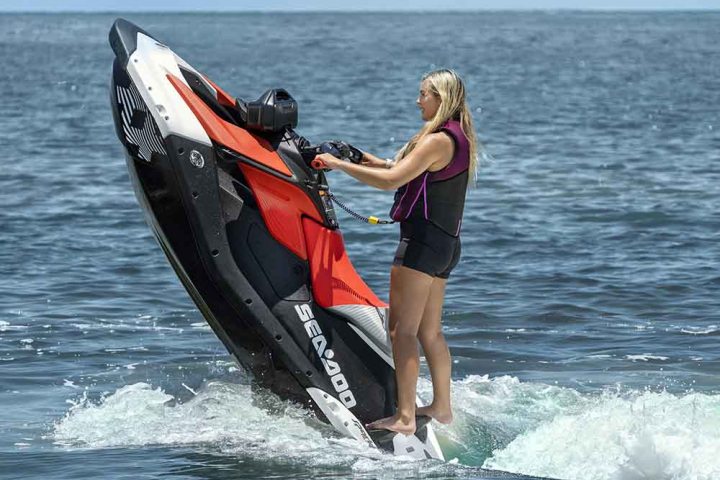 a person standing next to a body of water