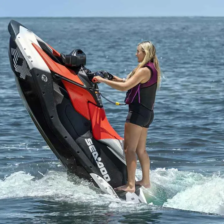 a person standing next to a body of water